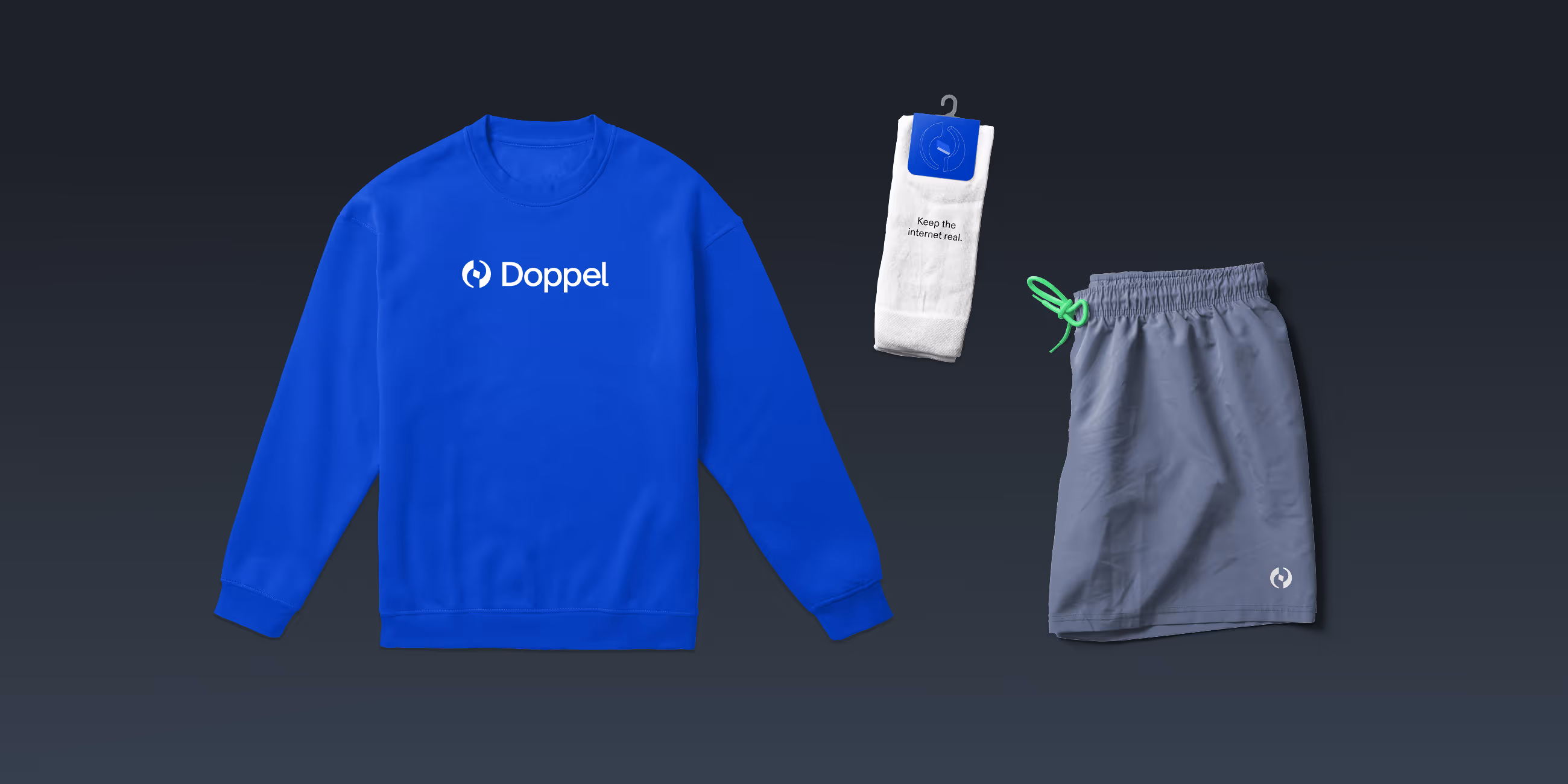 Blue sweatshirt with Doppel logo, white socks with text 'Keep the internet real,' and gray shorts with green drawstring laid out on dark background.