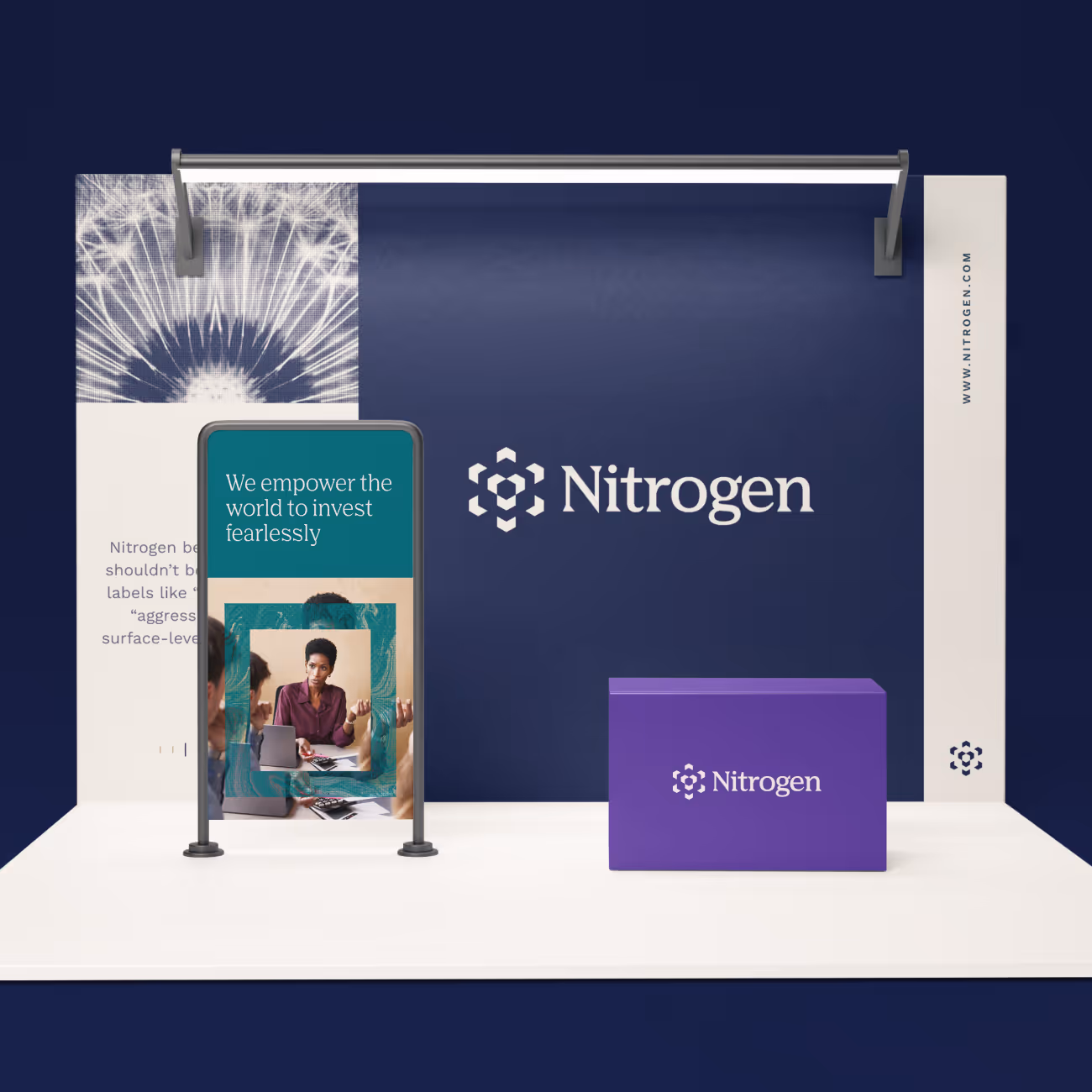 Trade show booth with Nitrogen logo, slogan to empower investing, and a purple table with branding.