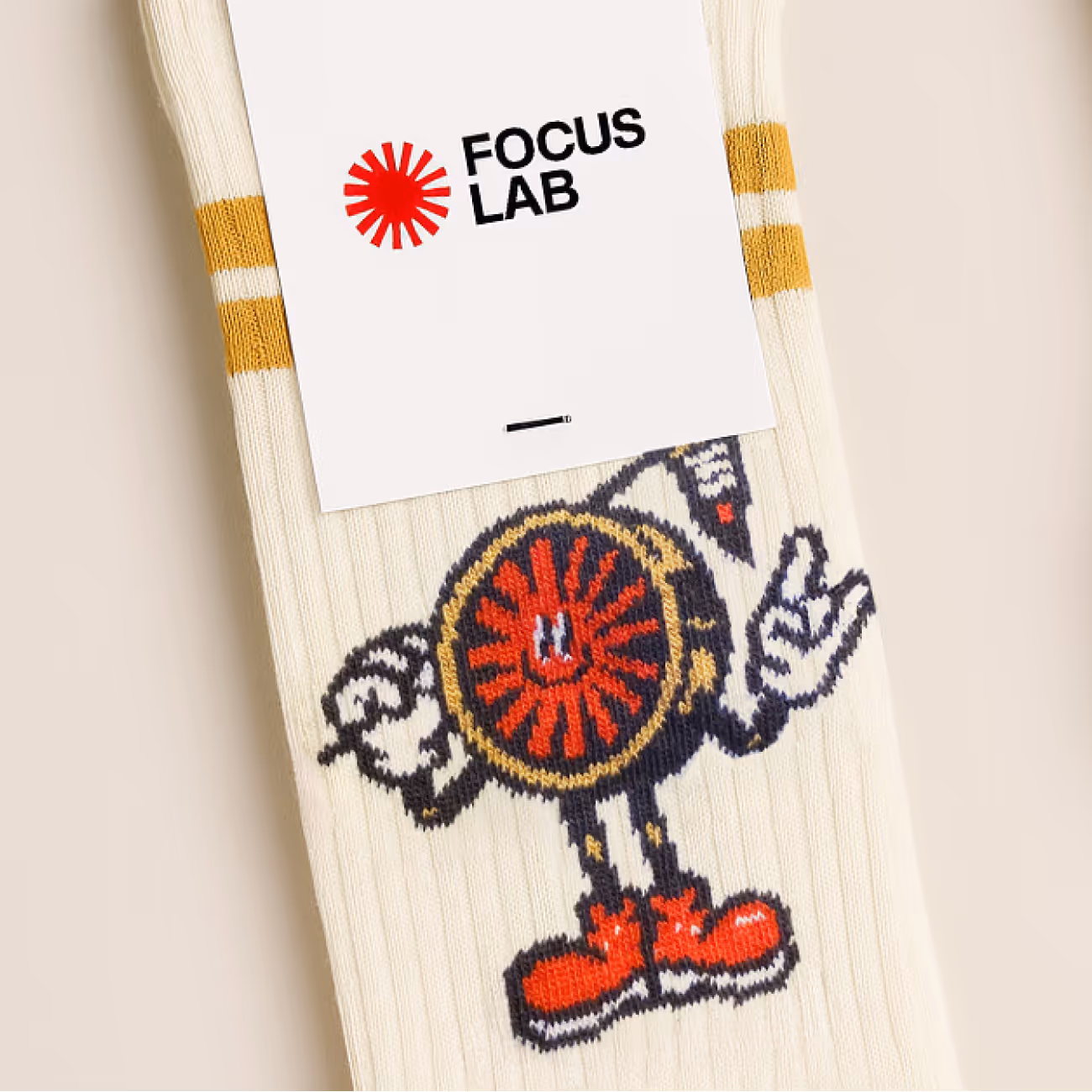White socks with yellow stripes and a cartoonish red and black eye character wearing red shoes and making hand gestures.