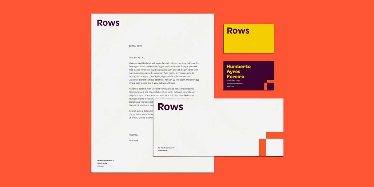 Branded letterhead, envelope, and business cards on a red background